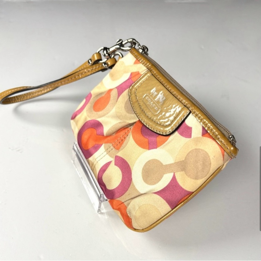 Coach Optic C Colorful Patterned Wristlet
Orange pink cream. Patent Leather - Picture 4 of 11